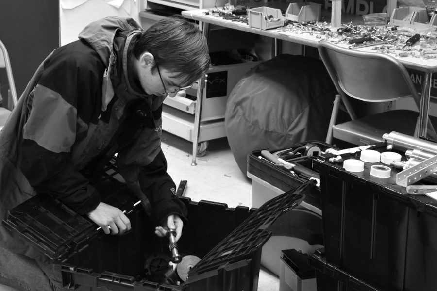 BUILDING Junior Casey Smith works in The Hive, the robotics team’s building space located at South Albany High School, at the Jan. 16 robotics team meeting.