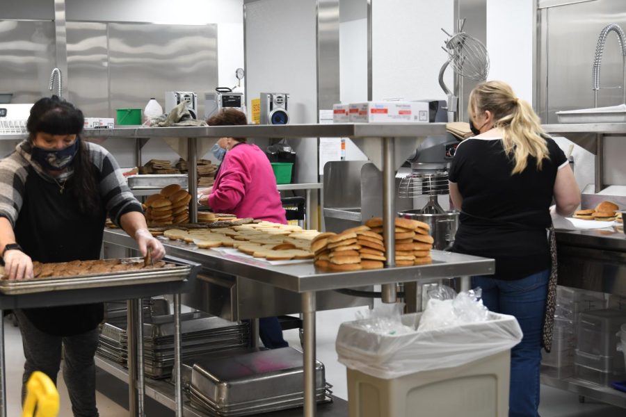  Kitchen Manager Kimberly Hill and coworkers Mary Gaspard and Donna Affinito prepare hamburger buns for the day’s lunches in the WAHS kitchen 