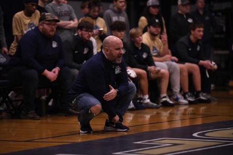 Coach Casey Horn cheering on his wrestlers.