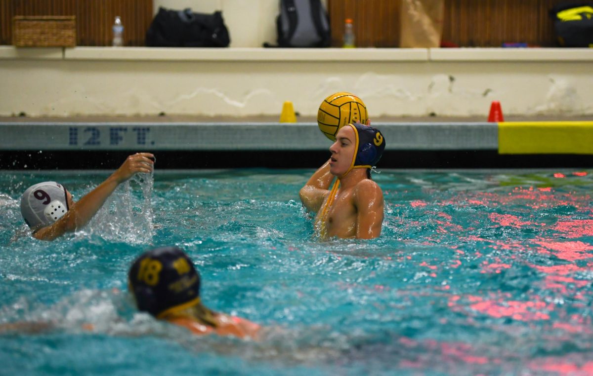 Senior team captain Tyson Ames ready to pass the ball to a teammate.