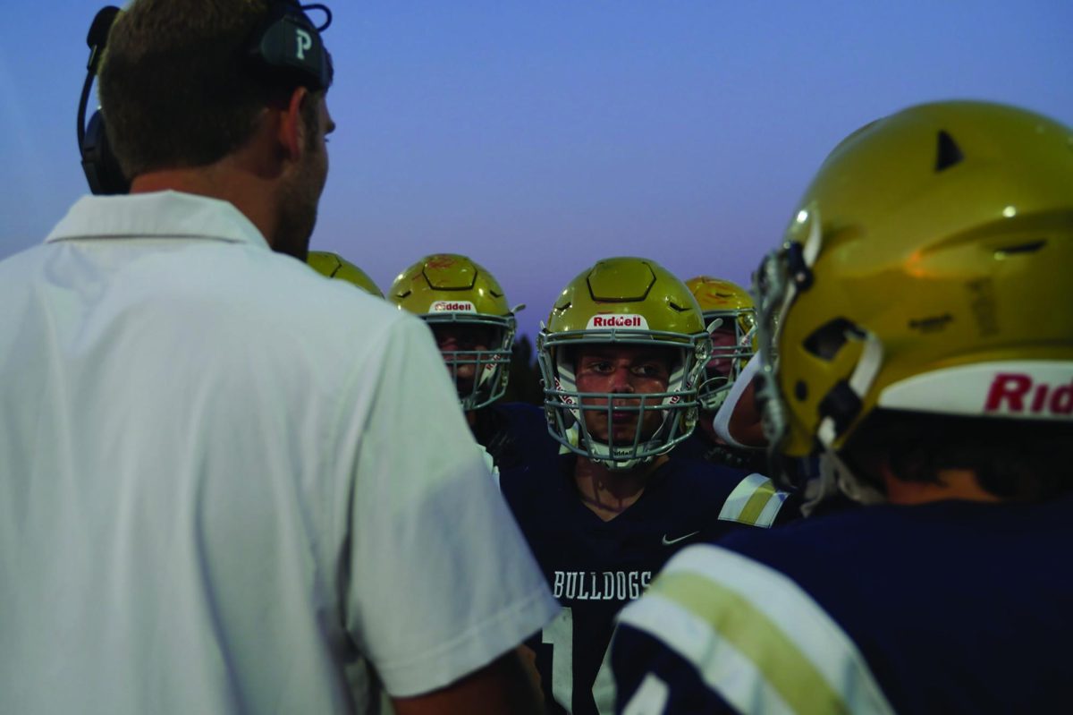 Offensive Director Sam Hartman coaches West Albany football team on Sept. 8. 