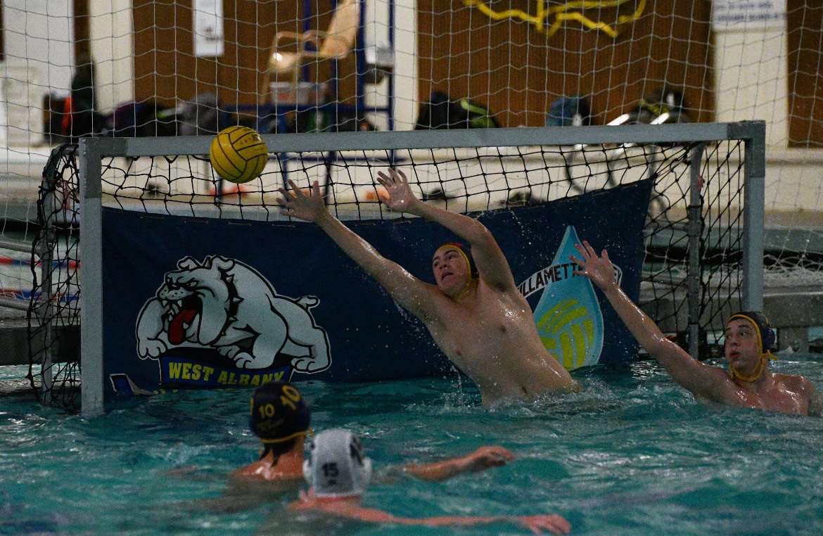 Sophomore Jakob Ylen blocking a ball from going into the net.