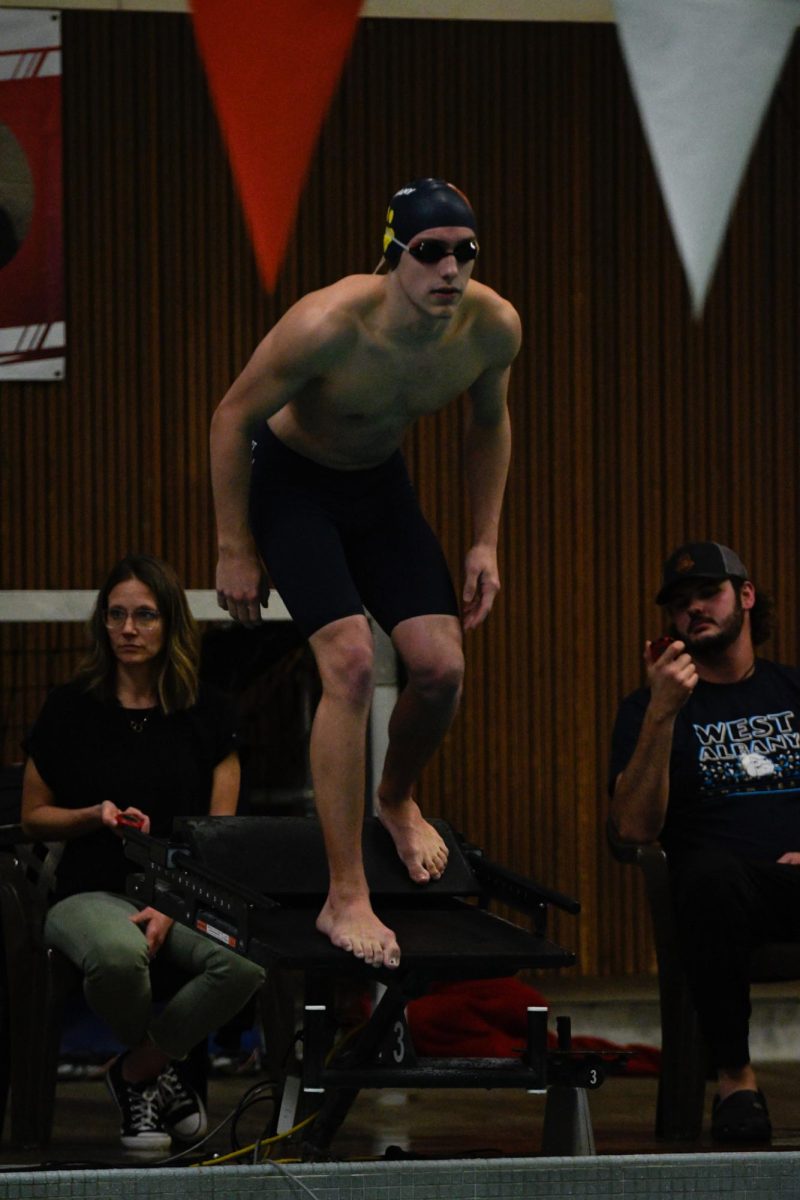 Senior Kyle Milburn swims against Cresent Valley on Jan. 23.
