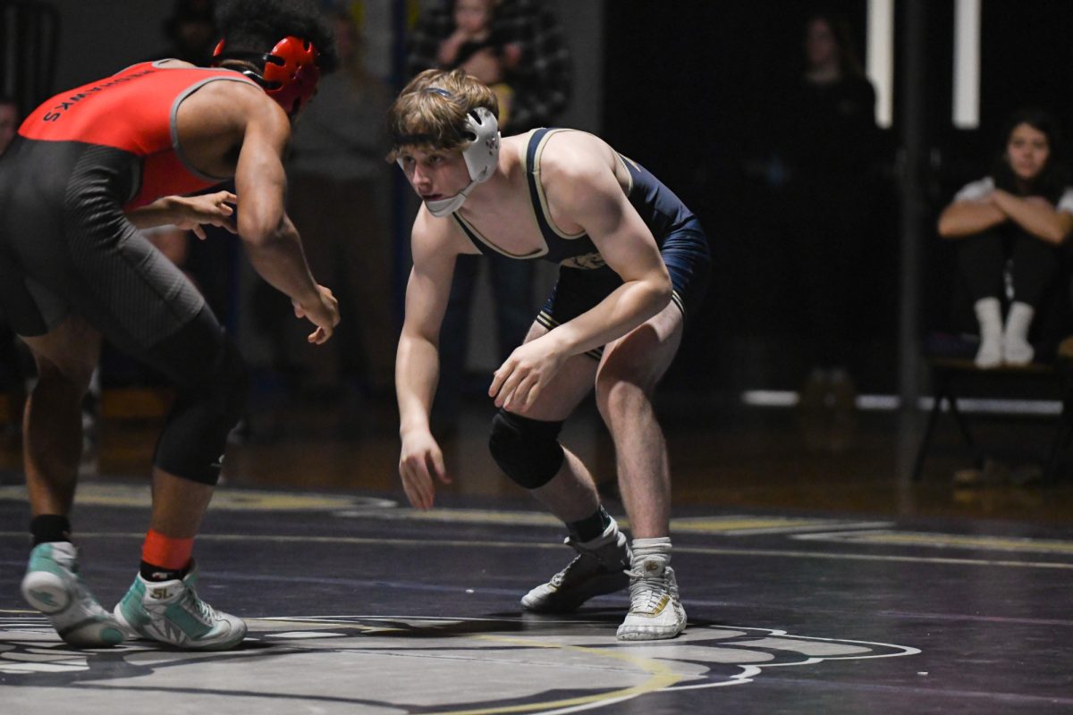 Senior Taylor Gauntlett gets in position to wrestle against South Albany.