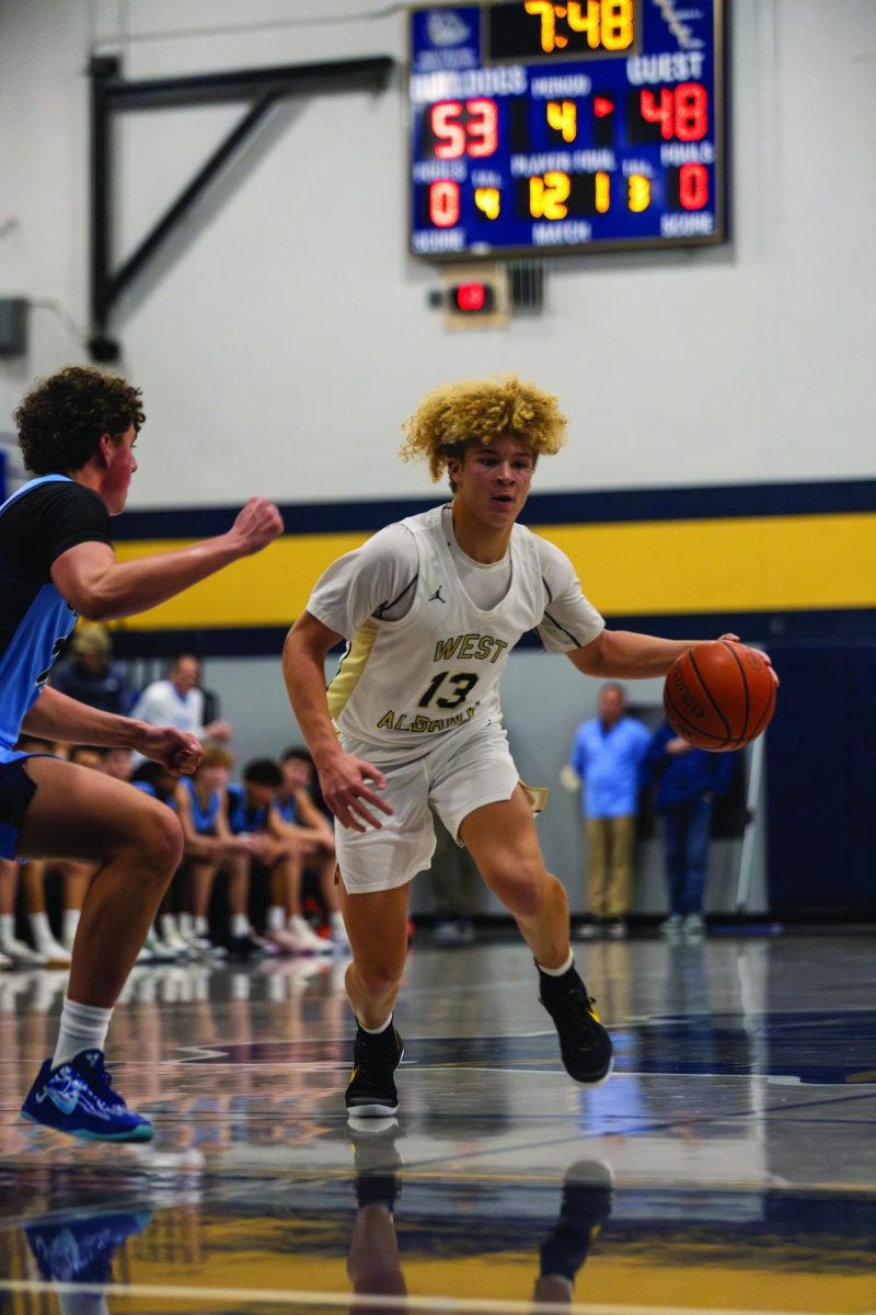 Junior Tyson Walker drives to the hoop on Jan. 14 against Corvallis High School.
